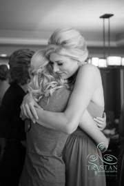 A bride hugging her mom before the wedding.