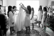 Bridesmaids ready to dress the bride before the wedding.